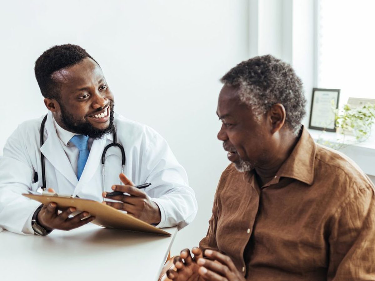 Somebody sitting with a relative at a consultation